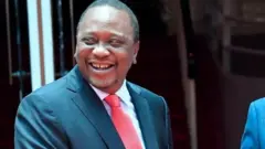 President Uhuru Kenyatta (L) shakes hands with the National Super Alliance (NASA) coalition opposition leader Raila Odinga
