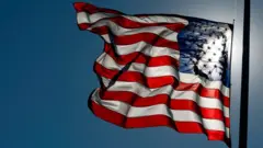 US flag flying at half-mast