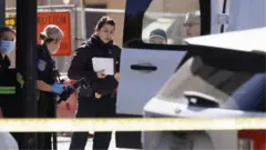 Coroner's officials at the crime scene