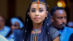 Woman wearing beads in her hair