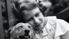 Princess Elizabeth, aged 10, with her pet dog, London.