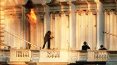 A hostage scrambles to safety