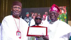Inec Chairman, Mahmood Yakubu present certificate of return to president-elect, Bola Tinubu