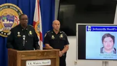 The photograph of Ryan Christopher Palmeter, 21, is shown at a news conference in Jacksonville