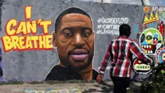 Un mural con la imagen de George Floyd