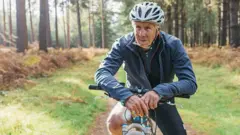Elderly man on a bike