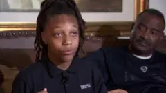 Amari Allen being interviewed alongside her grandfather