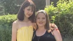 Bianca and Kimberly Devins photographed together in supplied image taken outside in garden