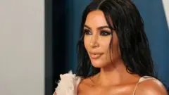 کم