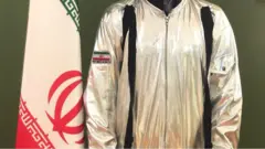بدلة فضاء "الشيطان الأعظم" تتحول إلى بدلة إيران الفضائية