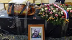 The backpack and the walking stick of Herve Gourdel, a 55-year-old French mountain guide who was kidnapped and beheaded by jihadists in Algeria last September