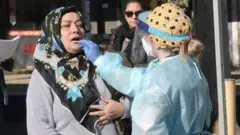Woman gets tested for coronavirus in Melbourne, Australia (file photo)
