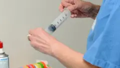 File image of dcotor with syringe