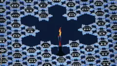 The Olympic flame in the giant snowflake