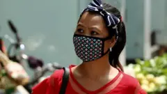 Woman wears protective mask in Bangalore, India