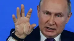 путін