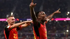 Michy Batshuayi celebrates scoring for Belgium