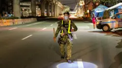 A police officer patrols in the Philippines