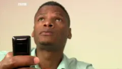 a picture of the reporter with a remote