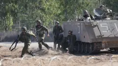 Israeli soldiers patrol along the border with southern Gaza, in Israel, 26 October 2023