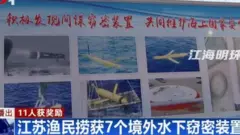 Tela de televisão chinesa mostra reportagem sobre drones encontrados pelo mar