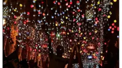 Two children in front of Ramadan decorative window