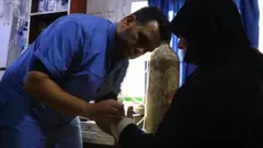Dr Ahmed al-Masri treating a patient