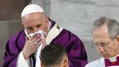 Pope Francis dey cover nose as im dey cough for Ash Wednesday mass service