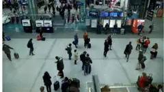 Sparse travellers at Gare Montparnasse in Paris on the eve of transport strike, 5 December 2019