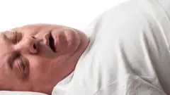 Overweight man asleep