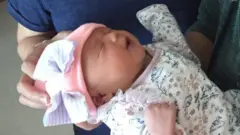 A new born baby girl.
