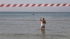lonely woman on the forbidden seashore