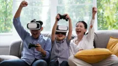 Father and son wearing the virtual reality glasses