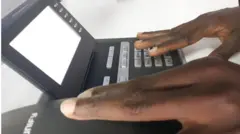 One BBC Pidgin tori pesin hold phone for hand to make call. Tuesday 03/12/19