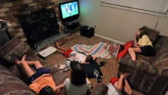 family watching tv