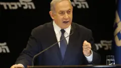 Israeli Prime Minister Benjamin Netanyahu speaks at a press conference regarding his intention to file a request to the Knesset for immunity from prosecution, in Jerusalem on January 1, 2020