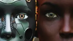 Female robot and human heads side by side