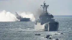 росія