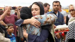 New Zealand Prime Minister Jacinda Ardern hugs a mosque-goer at the Kilbirnie Mosque in Wellington, following the mass shooting attacks on two mosques in Christchurch in 15 March 2019.