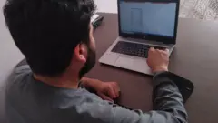 Habib with his laptop