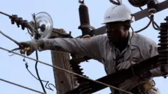 PHCN official climb electricity pole