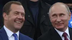 Медведев и Путин