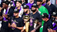 LeBron James and the Lakers celebrate with NBA trophy