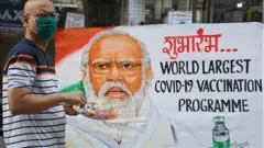 নরেন্দ্র মোদীর বিরুদ্ধে টিকা কর্মসূচীকে প্রোপাগান্ডা যন্ত্র হিসাবে ব্যবহারের অভিযোগ তুলেছেন ভারতীয় নাগরিক পিটার এম