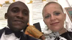 Gildas Tohouo (left) and im wife (Bernadett Kurucz) for Cathedral of Saints Peter and Paul, Douala, Cameroon.
