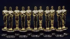 A view of 11 Oscars statues lined up next to each other in 1990 in Los Angeles, California.