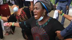 Mourner kneeling down