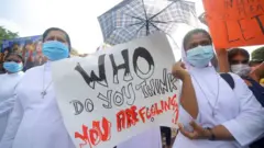 Sri Lankan catholic nuns hold placards during a protest at Colombo, Sri Lanka. Monday, 4 April 2022.