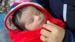 Keifaia Abu Asser gave birth to her daughter without painkillers due to a shortage in the hospital