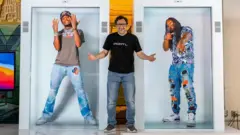 David Nussbaum with rapper Quavo, left, and former American football player Marshawn Lynch, right